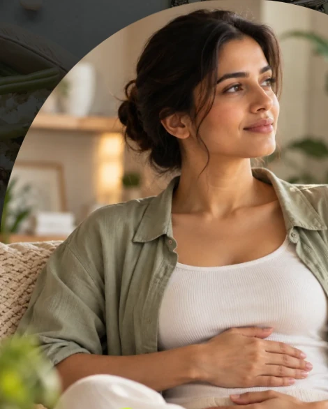 A woman reflecting calmly on her digestive wellbeing